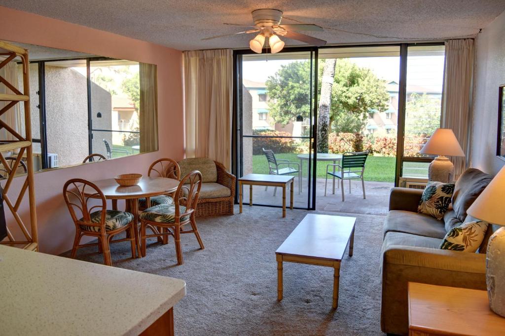 a living room with a couch and a table at Maui Vista 3105 in Kihei