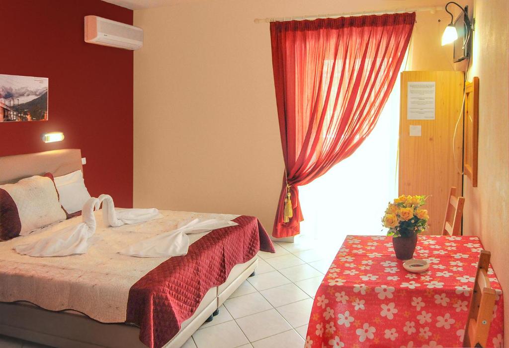 Postel nebo postele na pokoji v ubytování Panagiotis Hotel