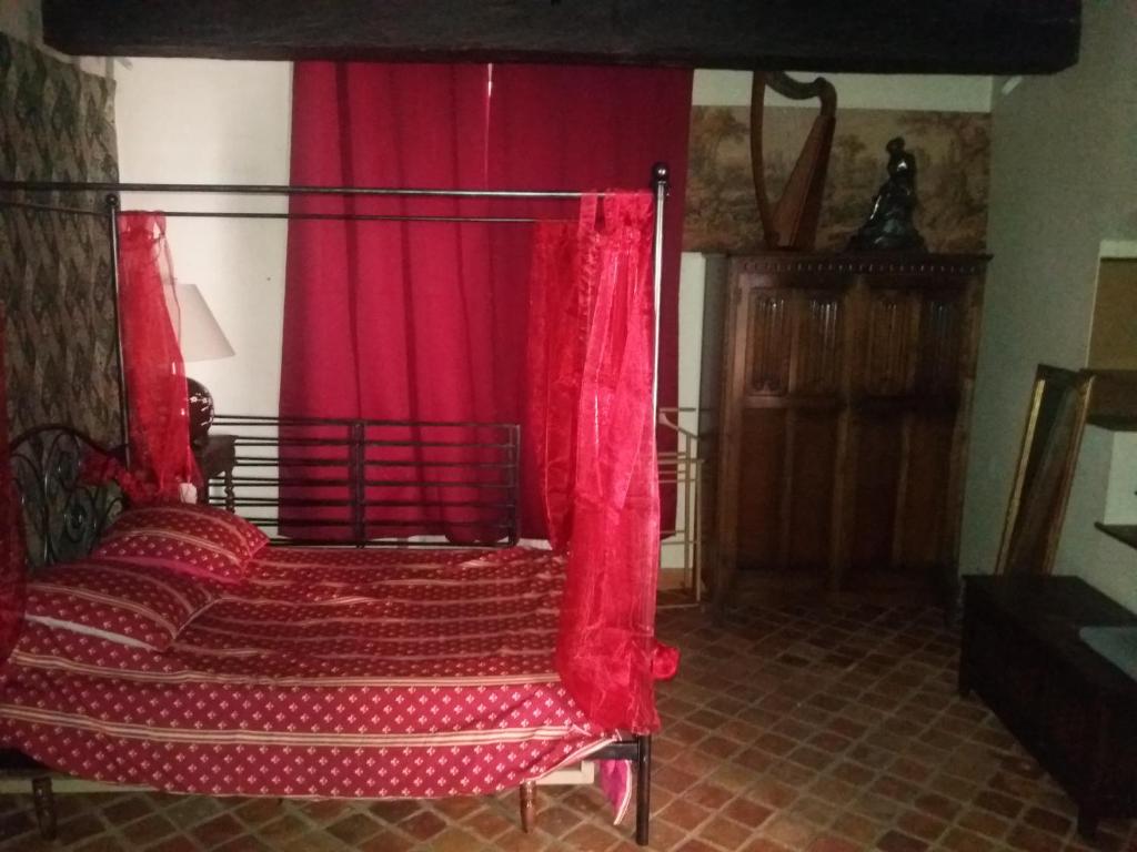 Postel nebo postele na pokoji v ubytování Commanderie des Templiers