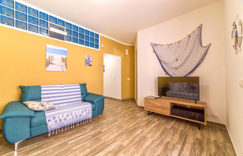 TV a/nebo společenská místnost v ubytování Al Mare