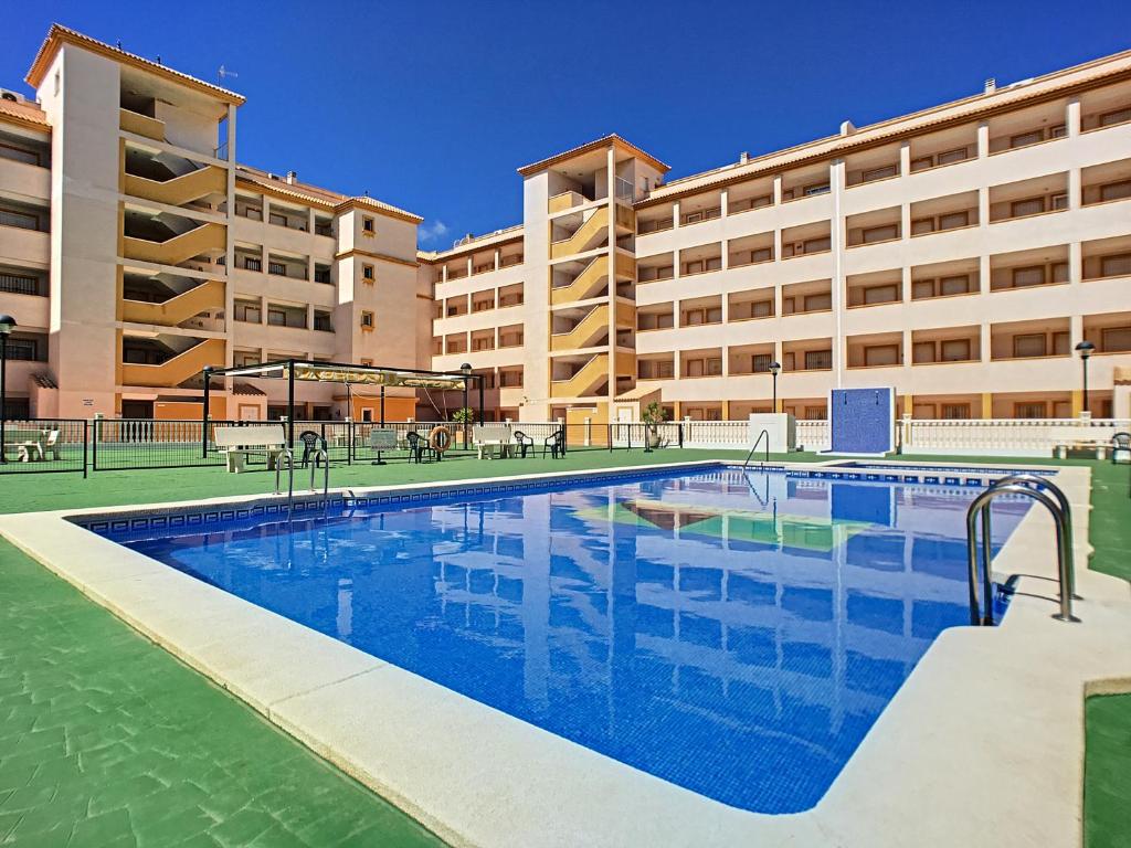 a large swimming pool in front of a building at Ribera Beach 3 - 2706 in Mar de Cristal