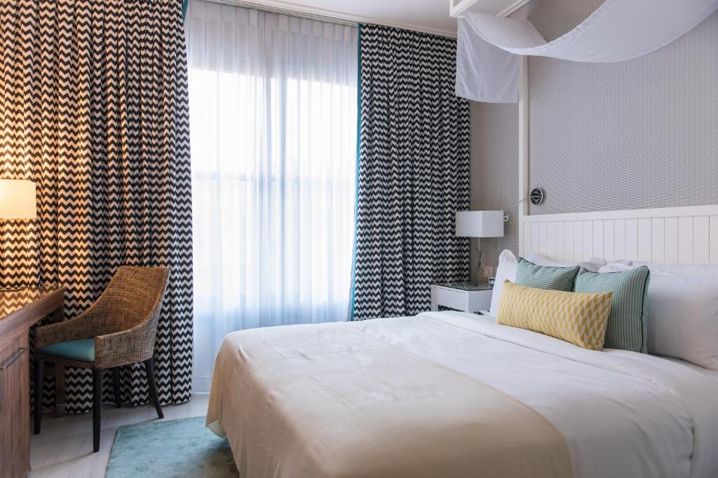 Postel nebo postele na pokoji v ubytování Melody Hotel - an Atlas Boutique Hotel
