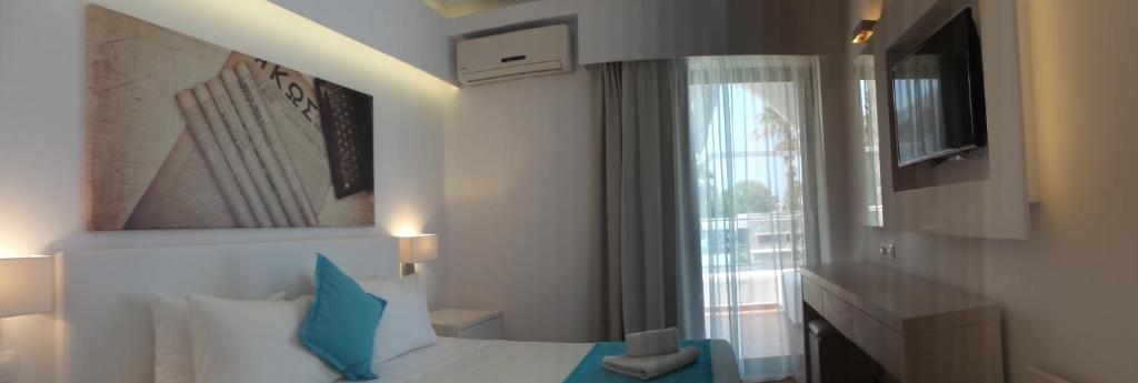 Postel nebo postele na pokoji v ubytování Cosmopolitan Hotel
