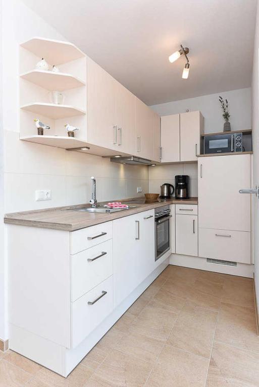 Kuchyň nebo kuchyňský kout v ubytování Ferienwohnung Seeperle