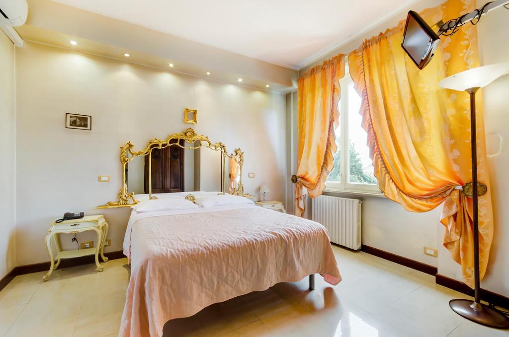 Posteľ alebo postele v izbe v ubytovaní Hotel Original