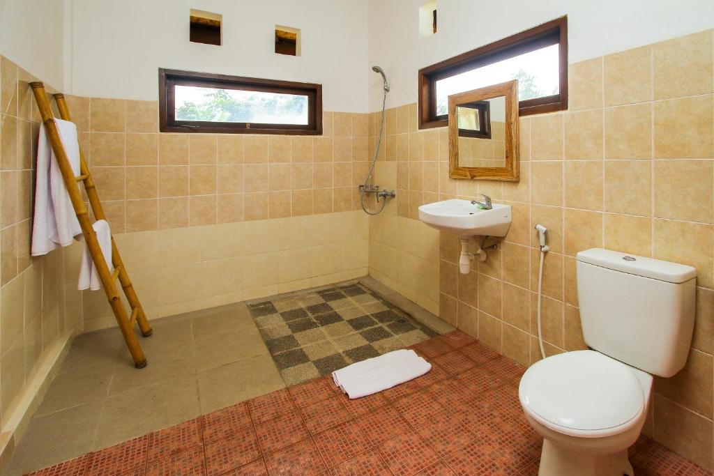 Koupelna v ubytování Manggis Sari Guesthouse