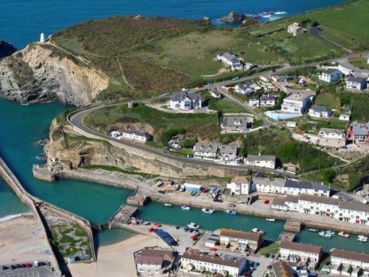 an aerial view of a town with a harbor at Quayside Cottage in Portreath
