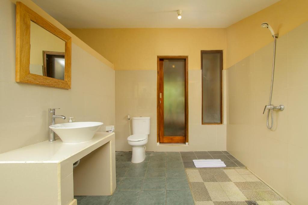 Koupelna v ubytování Manggis Sari Guesthouse