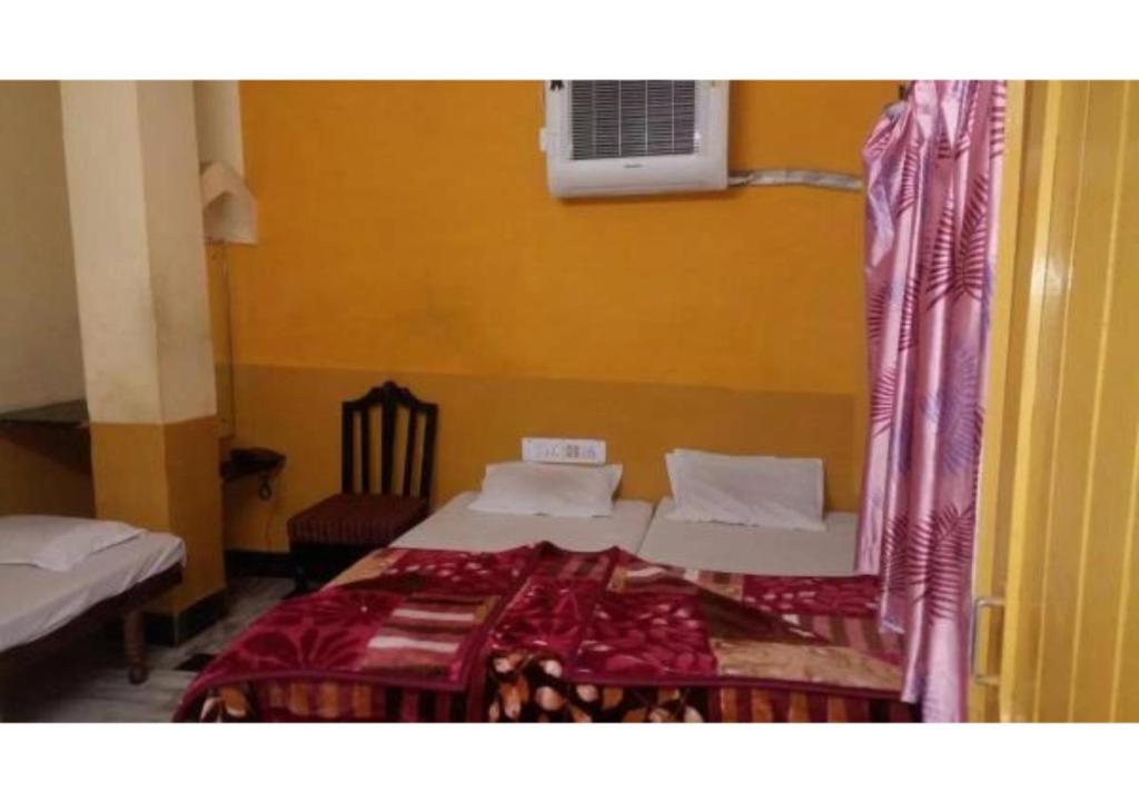 Llit o llits en una habitació de Hotel siddarth