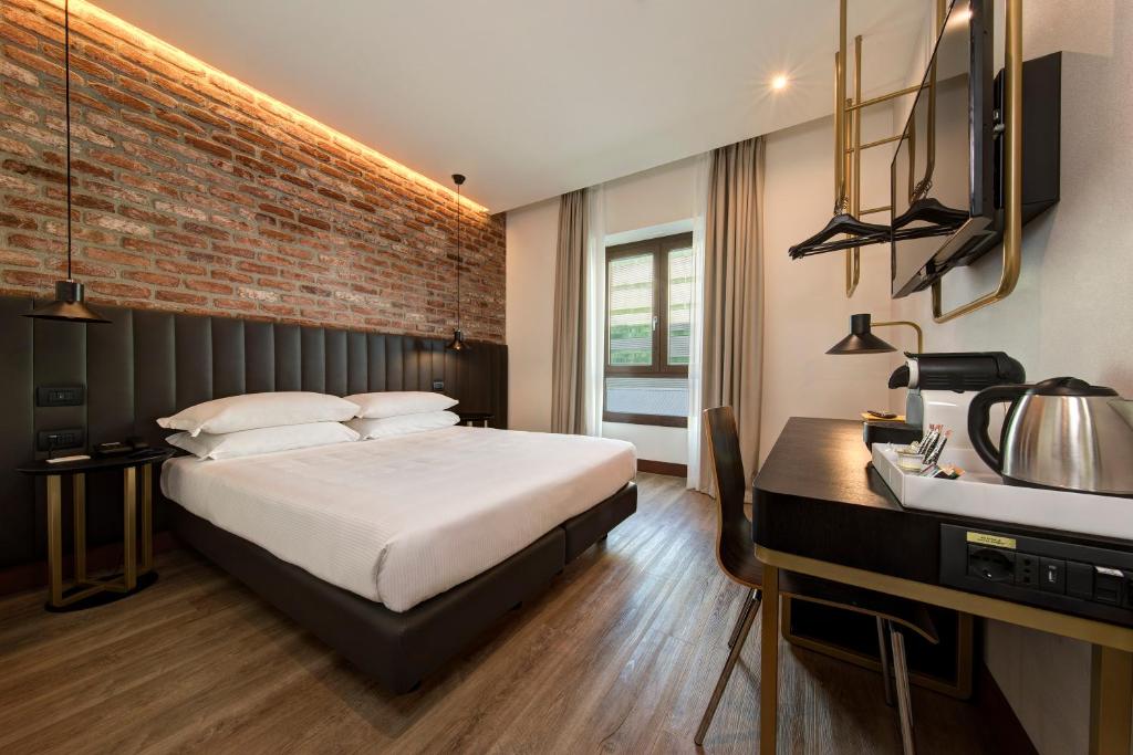 Postel nebo postele na pokoji v ubytování Best Western Hotel Tritone
