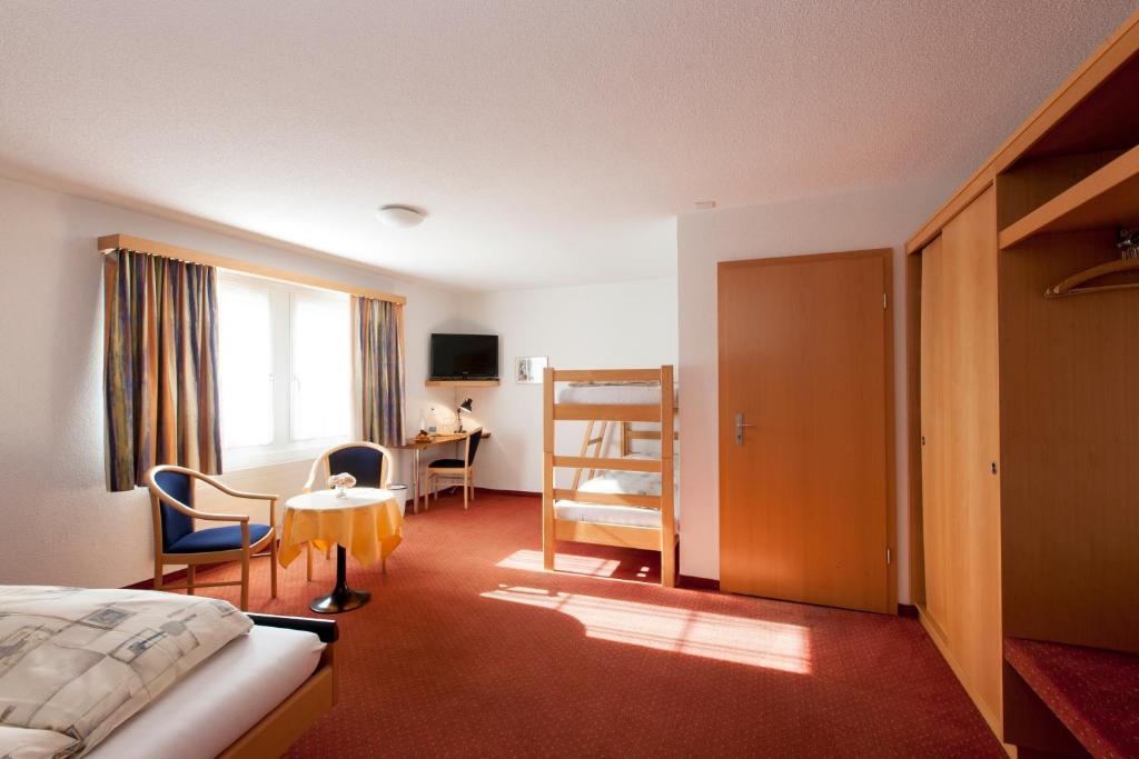 Postel nebo postele na pokoji v ubytování Hotel Arkanum