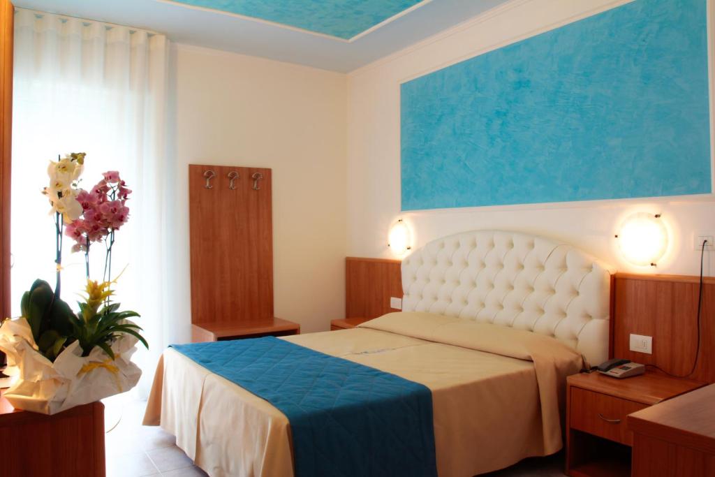 Postel nebo postele na pokoji v ubytování Hotel Hollywood***S