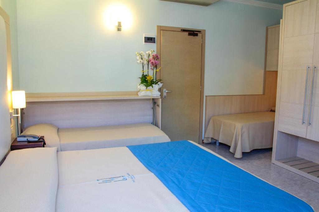Postel nebo postele na pokoji v ubytování Hotel Hollywood***S