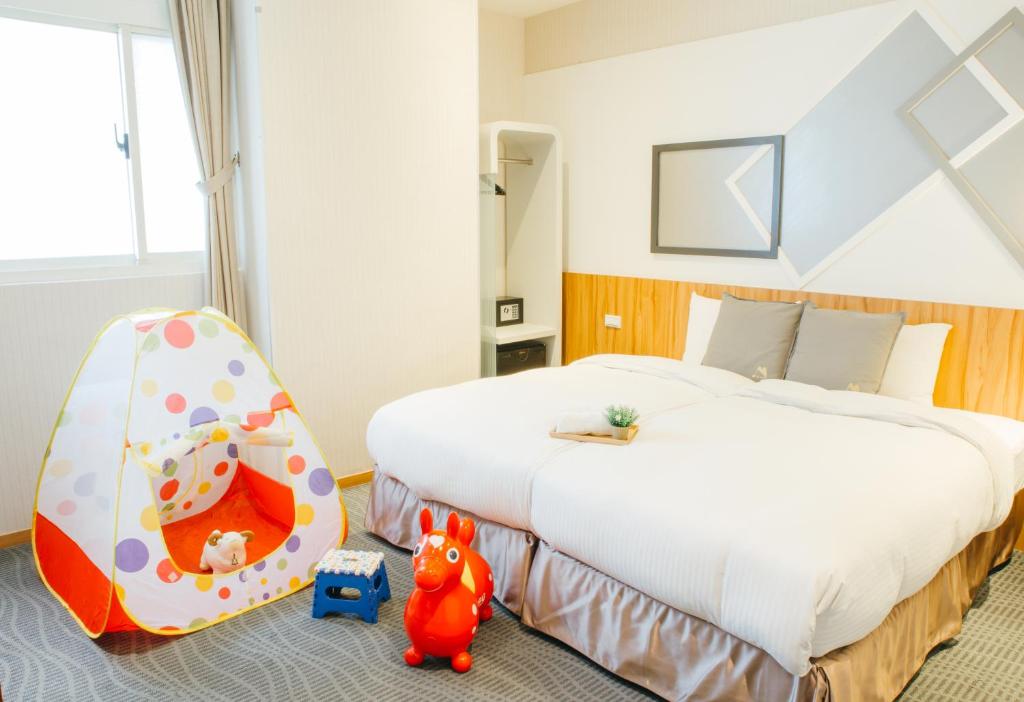 Postel nebo postele na pokoji v ubytování Muzik Hotel - Ximending Xining Branch