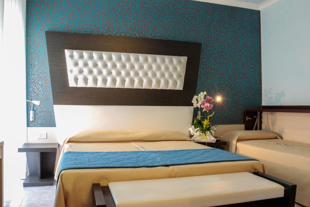Postel nebo postele na pokoji v ubytování Hotel Hollywood***S