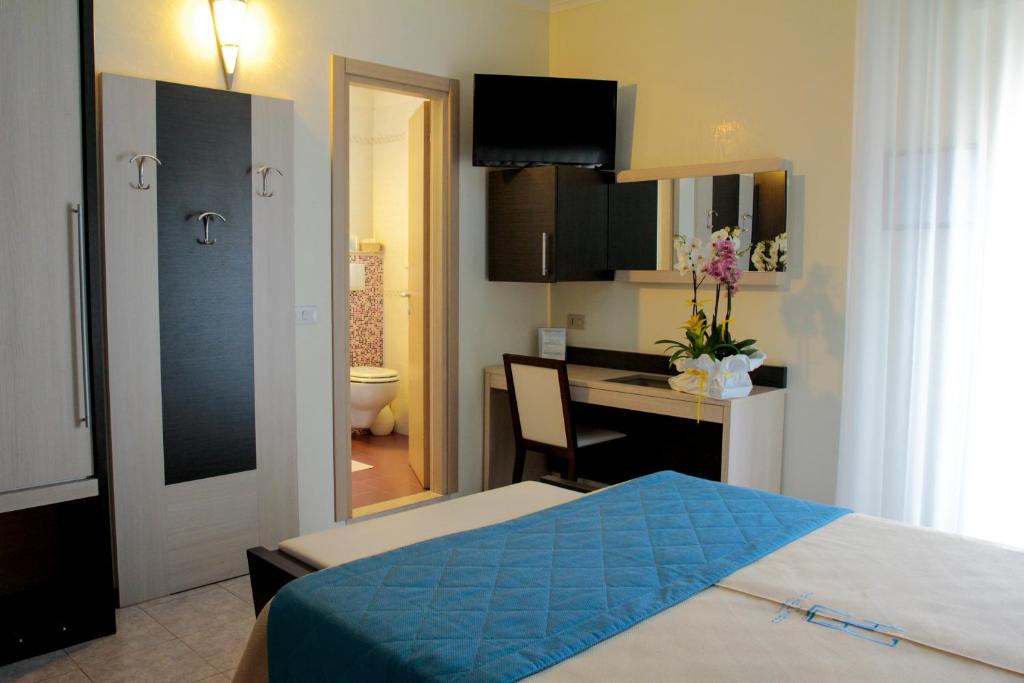 Postel nebo postele na pokoji v ubytování Hotel Hollywood***S