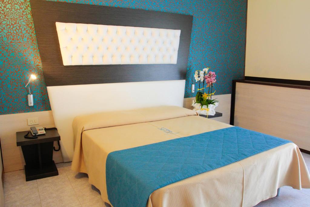 Postel nebo postele na pokoji v ubytování Hotel Hollywood***S