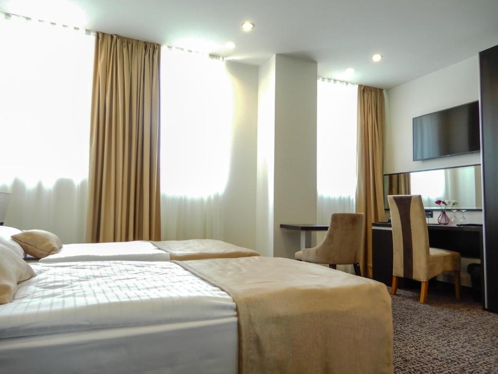 Posteľ alebo postele v izbe v ubytovaní Hotel Diplomat