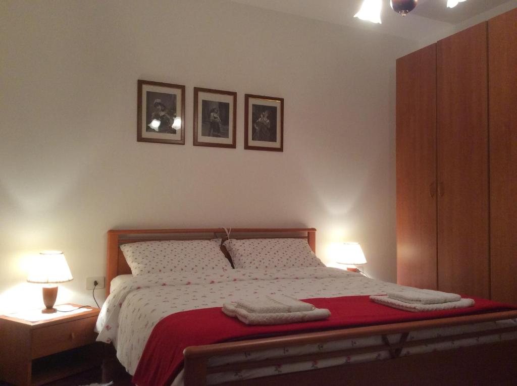 Postel nebo postele na pokoji v ubytování Casa Vacanze All'Orizzonte Duino