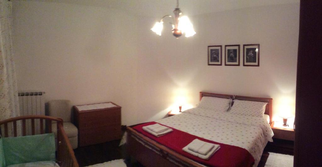 Postel nebo postele na pokoji v ubytování Casa Vacanze All'Orizzonte Duino