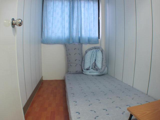 Postel nebo postele na pokoji v ubytování Ku Shan Yuan Hotel