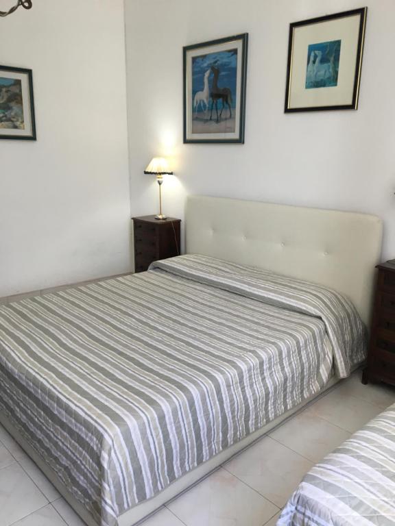 Postel nebo postele na pokoji v ubytování B&B Maison Rosetta IUN-E4948