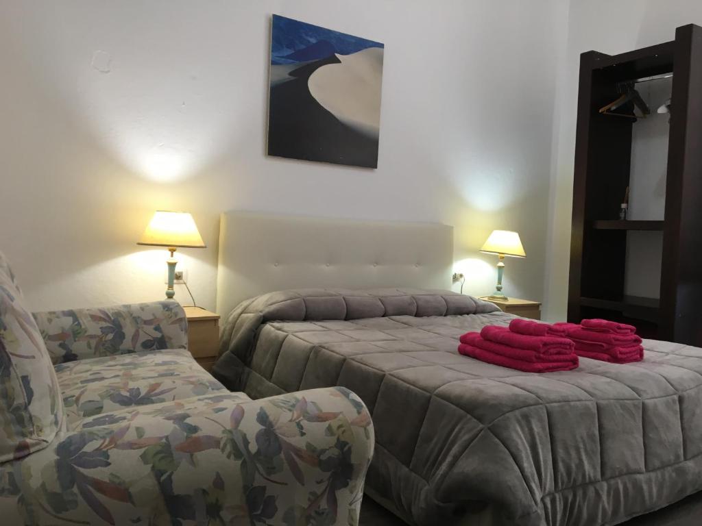 Postel nebo postele na pokoji v ubytování B&B Maison Rosetta IUN-E4948