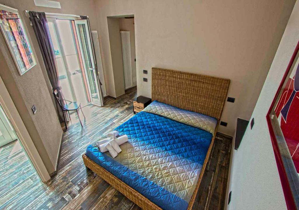 Postel nebo postele na pokoji v ubytování Oltremare Guest House