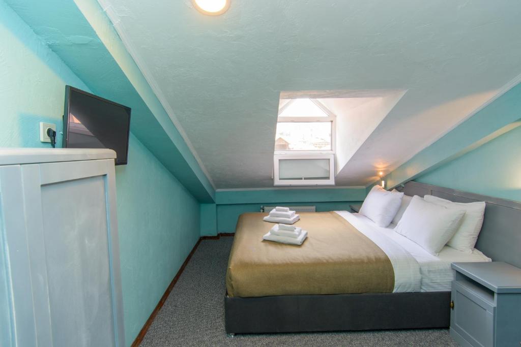 Postel nebo postele na pokoji v ubytování Kindli Boutique Hotel
