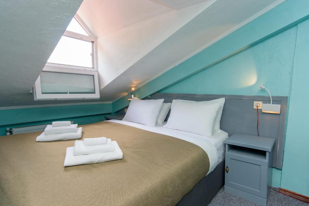 Postel nebo postele na pokoji v ubytování Kindli Boutique Hotel