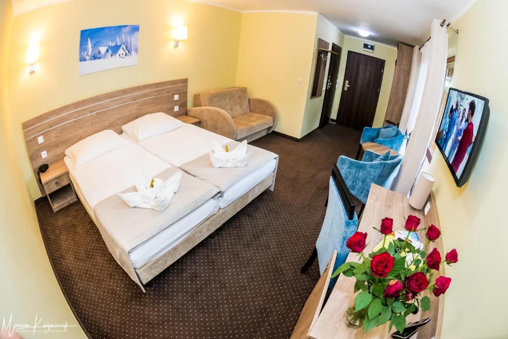 Postel nebo postele na pokoji v ubytování Hotel Na Skarpie