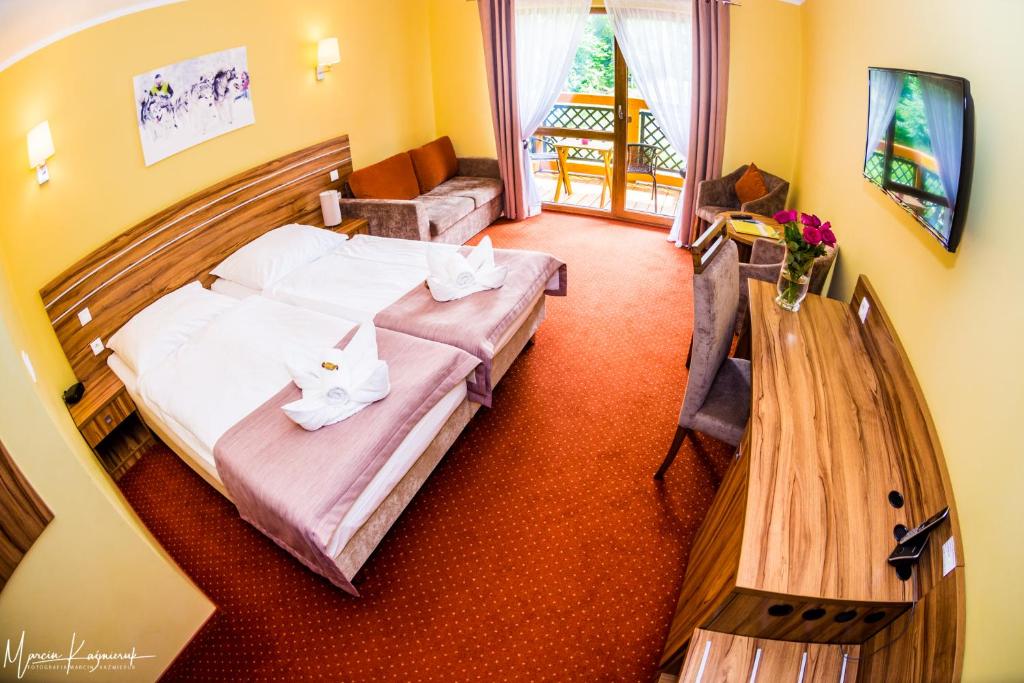 Postel nebo postele na pokoji v ubytování Hotel Na Skarpie