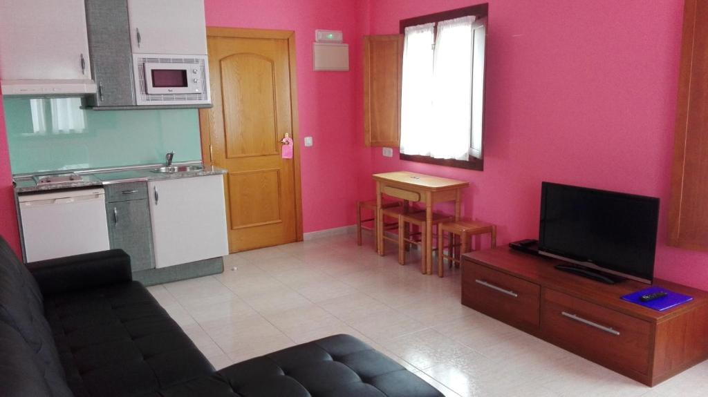 A kitchen or kitchenette at Apartamentos Las Rosas