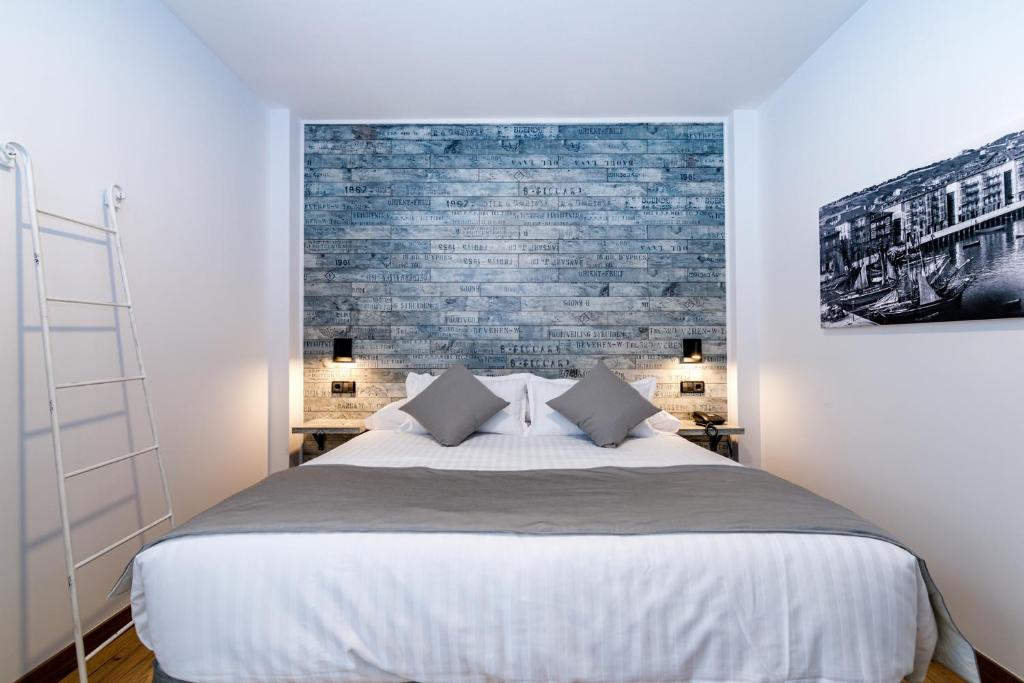 Rúm í herbergi á Suite Home Pinares