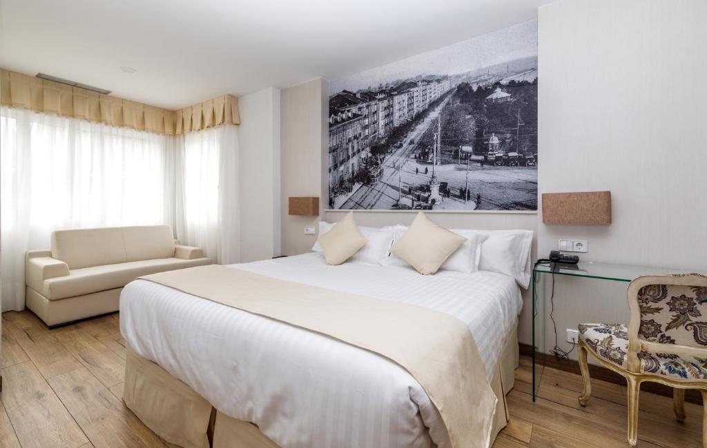 Rúm í herbergi á Suite Home Pinares