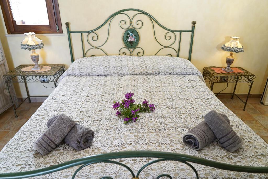Postel nebo postele na pokoji v ubytování Masseria Le Terrazze di Serranova