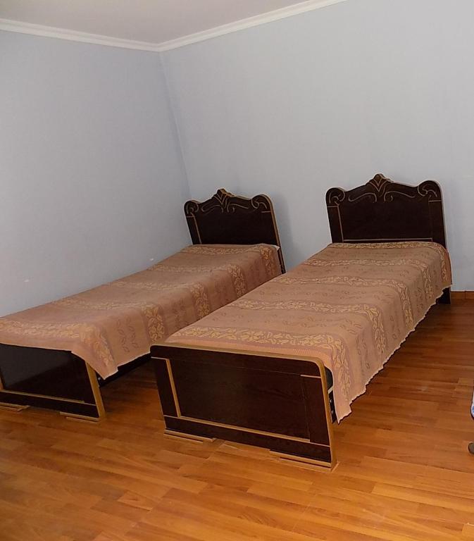 Postel nebo postele na pokoji v ubytování Guest Houze Nona
