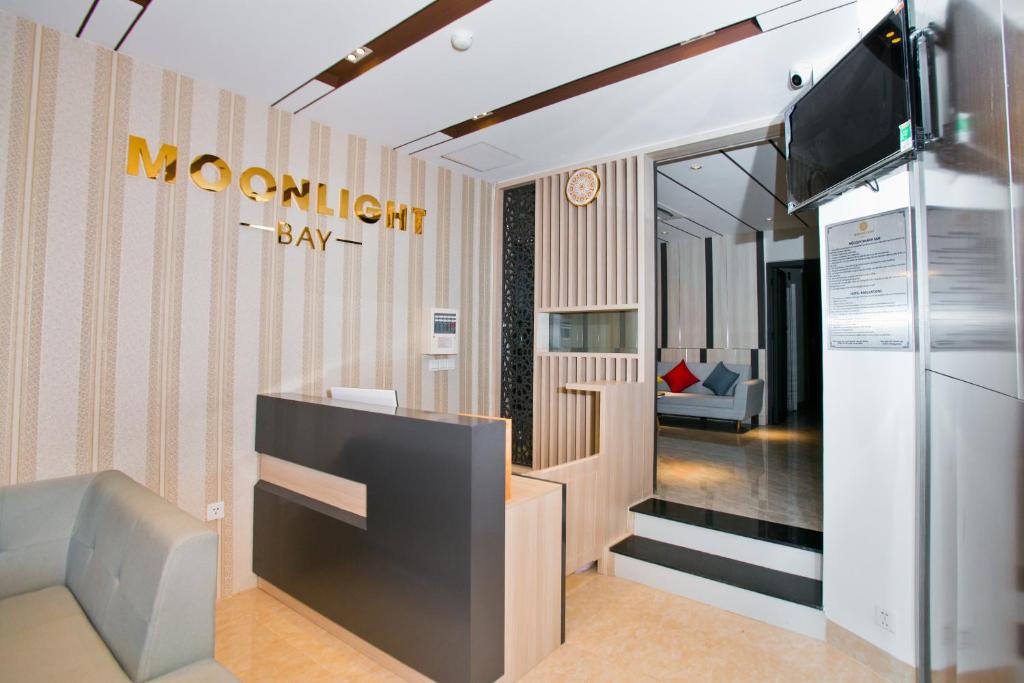 TV a/nebo společenská místnost v ubytování Moonlight Bay Hotel & Apartment