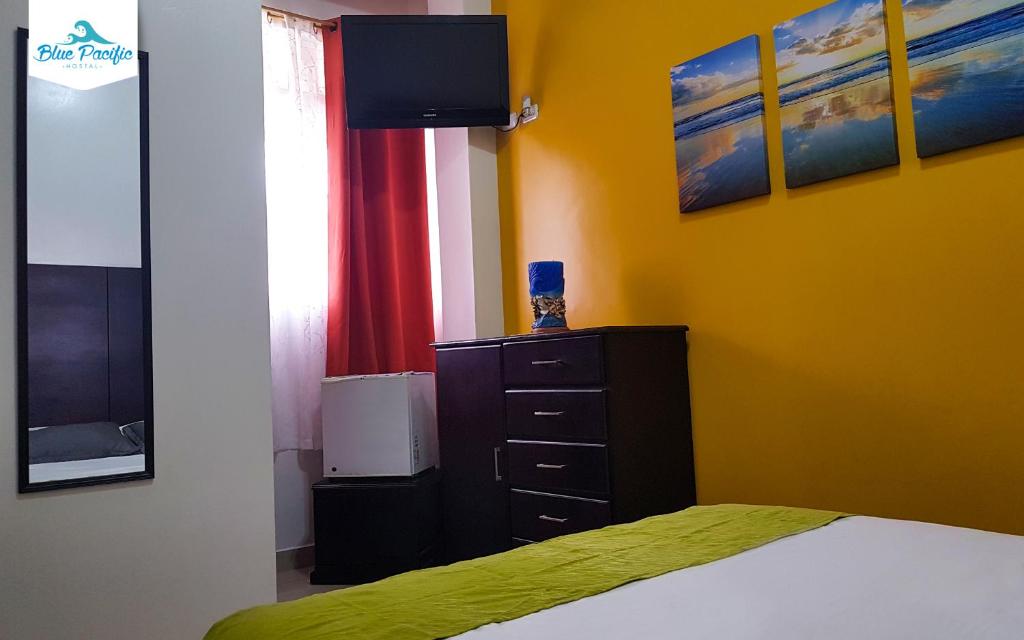 Postel nebo postele na pokoji v ubytování Hostal Blue Pacific