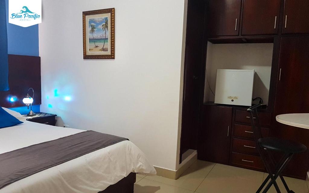 Postel nebo postele na pokoji v ubytování Hostal Blue Pacific