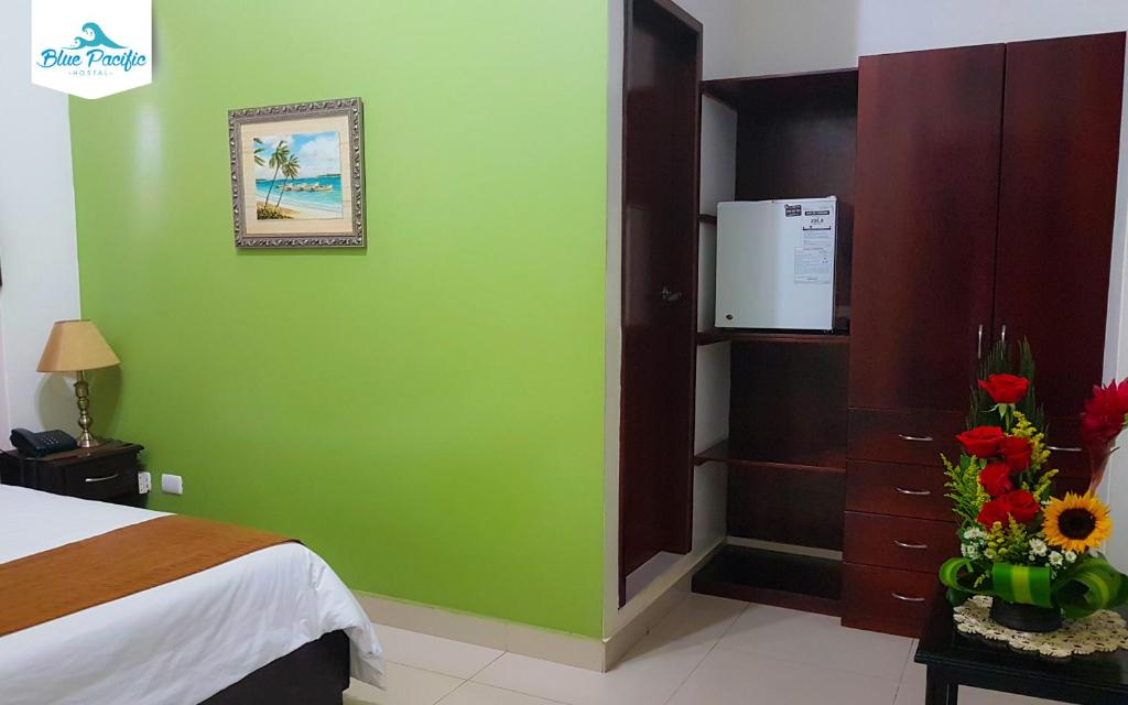 Postel nebo postele na pokoji v ubytování Hostal Blue Pacific