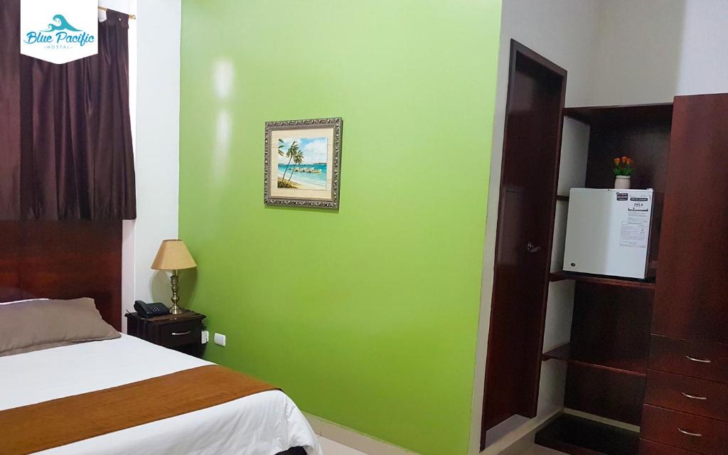 Postel nebo postele na pokoji v ubytování Hostal Blue Pacific