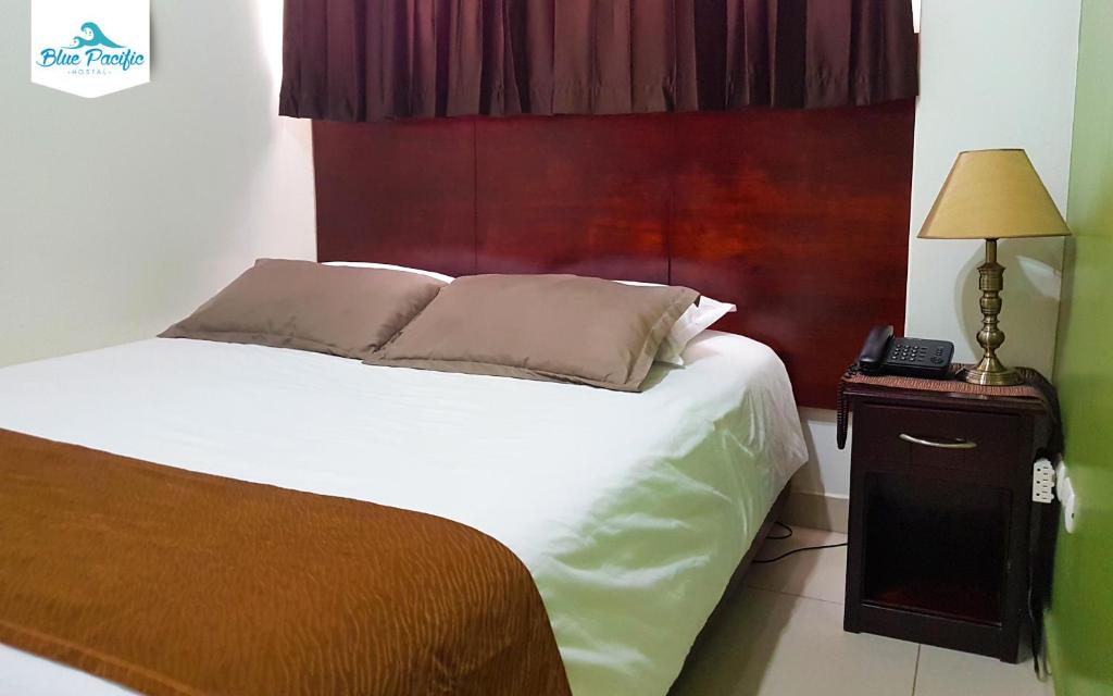 Postel nebo postele na pokoji v ubytování Hostal Blue Pacific