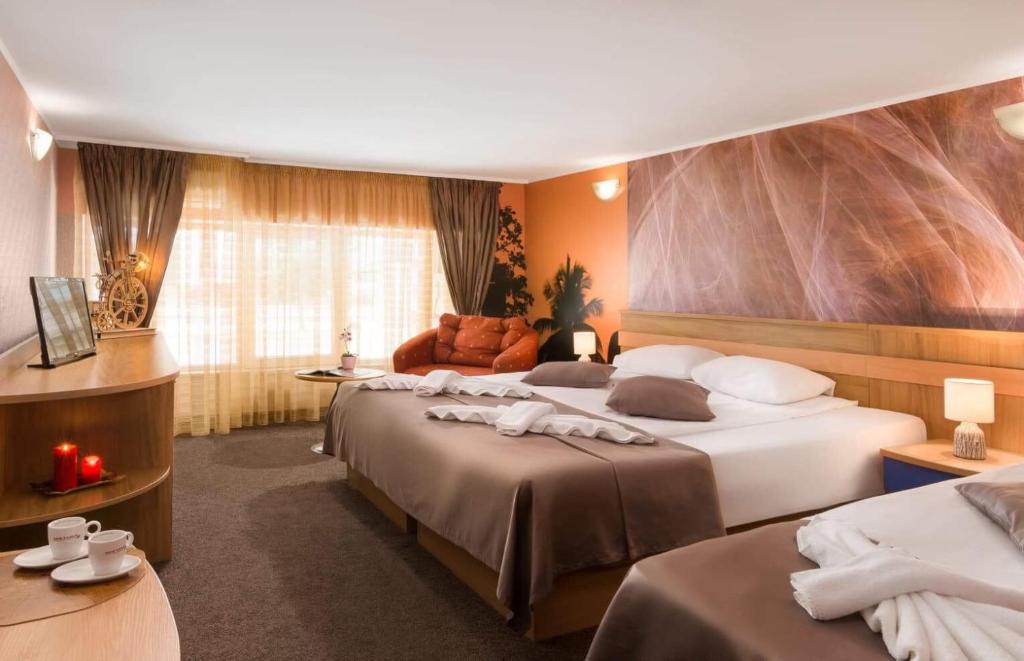 Postel nebo postele na pokoji v ubytování Hotel Central Point