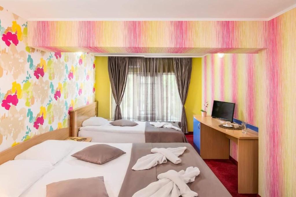 Postel nebo postele na pokoji v ubytování Hotel Central Point