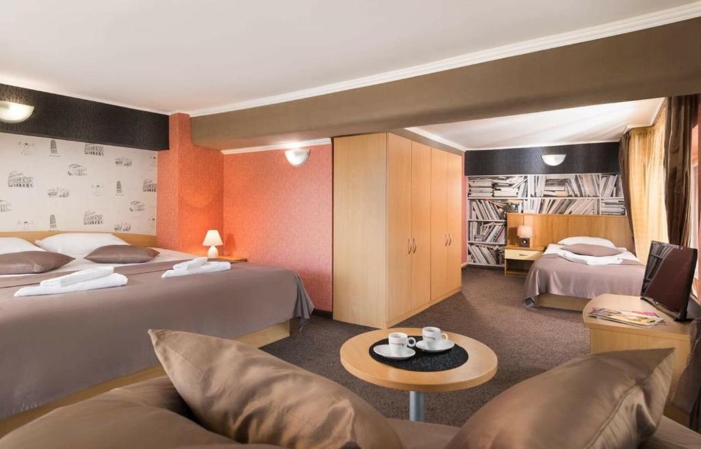 Postel nebo postele na pokoji v ubytování Hotel Central Point