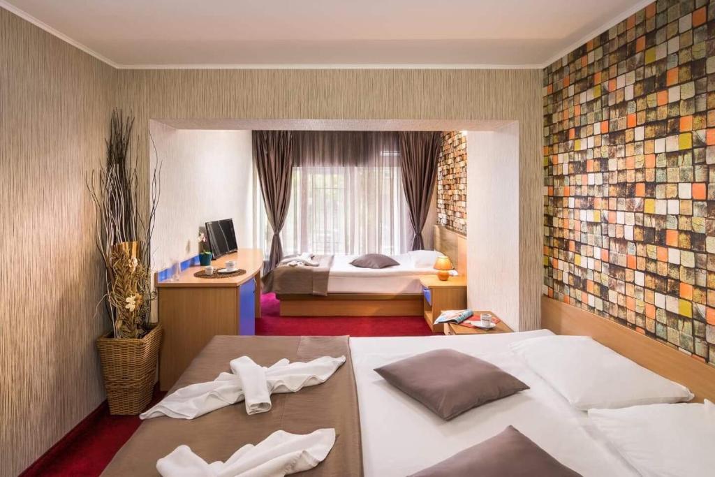 Postel nebo postele na pokoji v ubytování Hotel Central Point