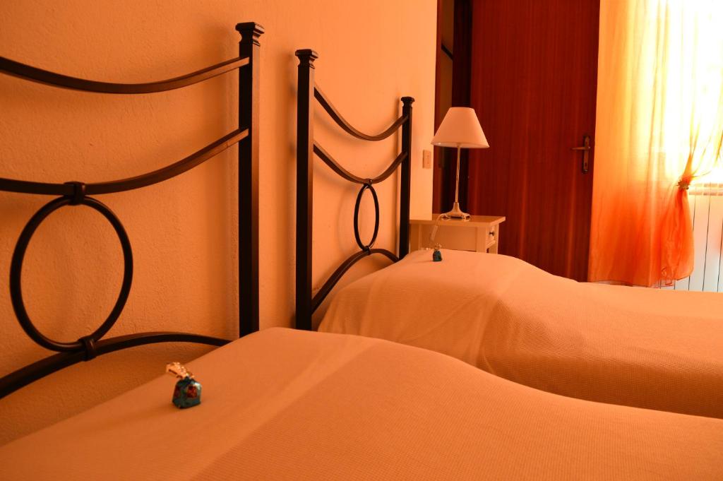 A bed or beds in a room at Il Giardino Nel Parco R&B
