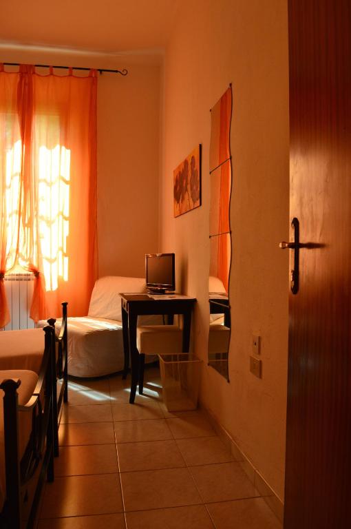 A bed or beds in a room at Il Giardino Nel Parco R&B