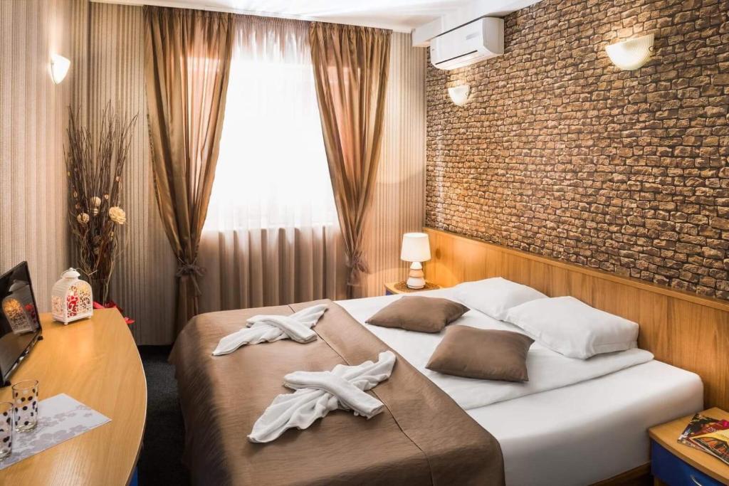 Postel nebo postele na pokoji v ubytování Hotel Central Point